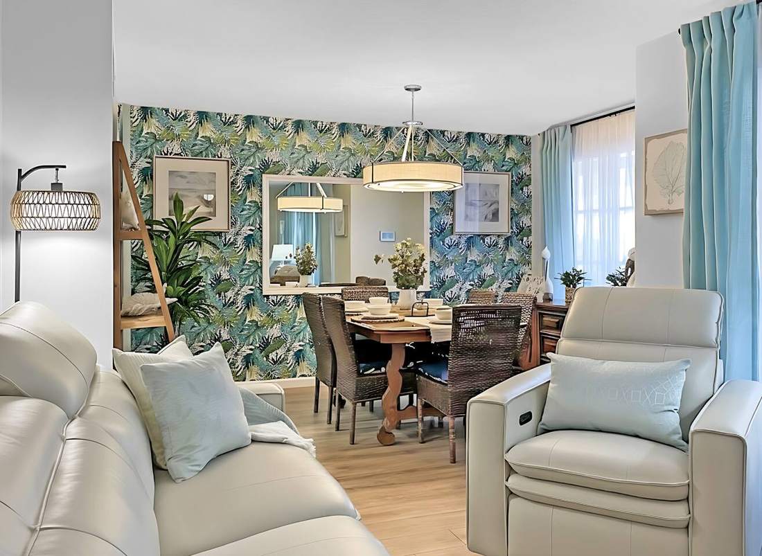 Living room recliners with the palm-wallpapered dining room beyond